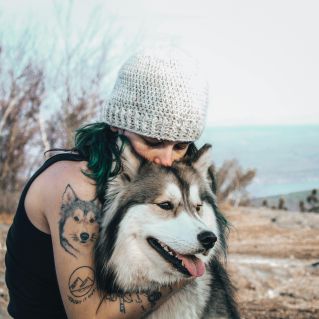 Woman Hugging a Dog